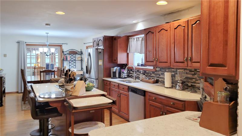 The kitchen has quartz counters