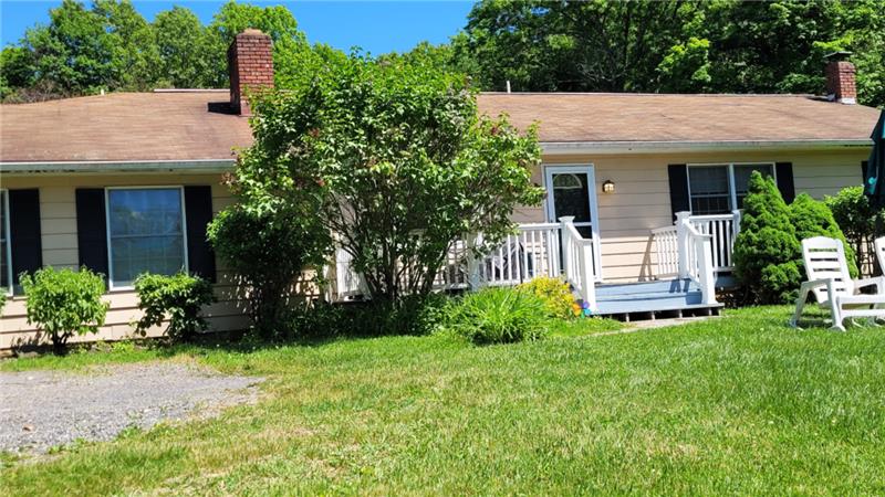 This porch leads to the four-bedroom unit
