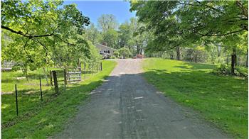 This treelined  driveway brings you to this multi-unit home