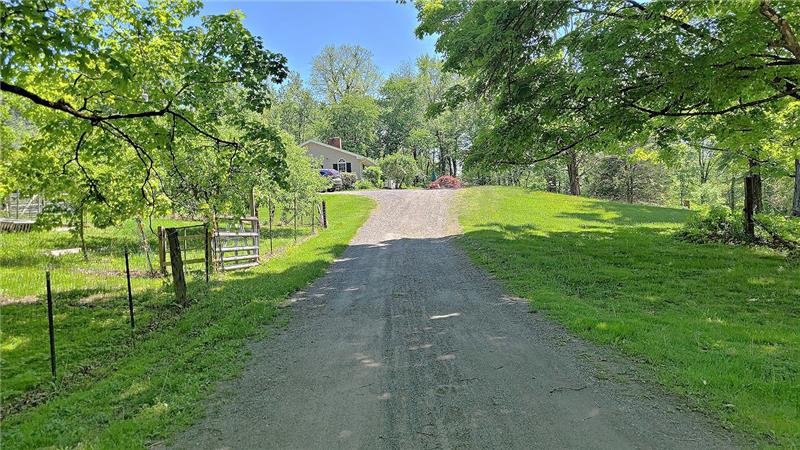 This treelined  driveway brings you to this multi-unit home