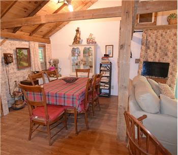 Vaulted wood-paneled ceiling with exposed beams