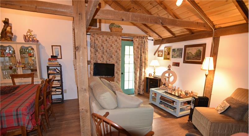 aulted wood-paneled ceiling with exposed beams
