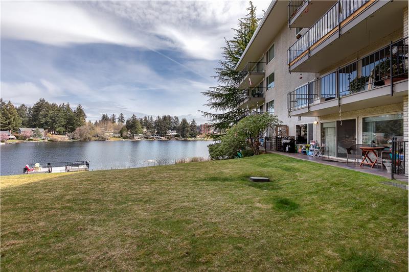 The bottom condo is yours! Slider off living room to your patio where you can grill, garden, relax, or stroll down to the lake!