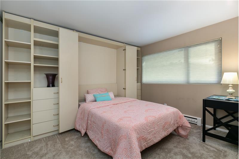 2nd Bedroom has custom cabinetry with a fold-out Murphy bed.