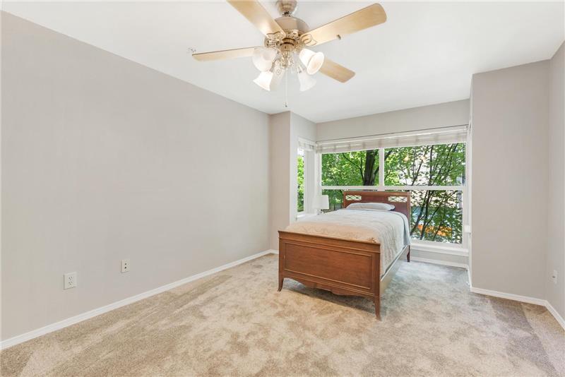 This spacious bedroom will easily accomodate a king or queen size bed.