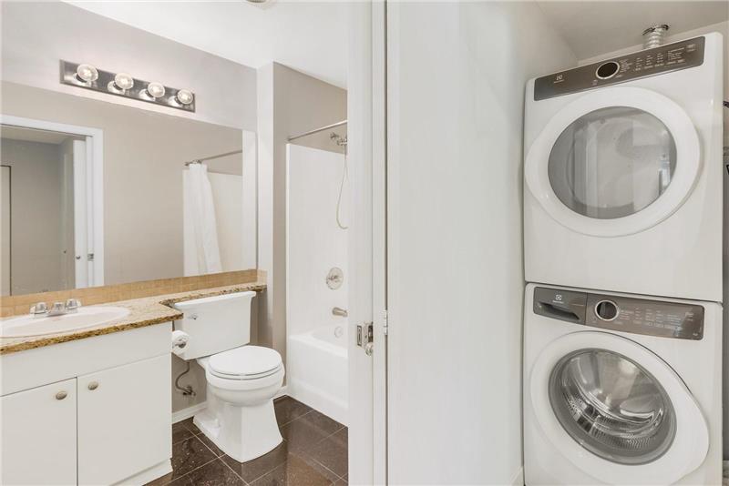 Full-size stacked washer/dryer in unit is included.