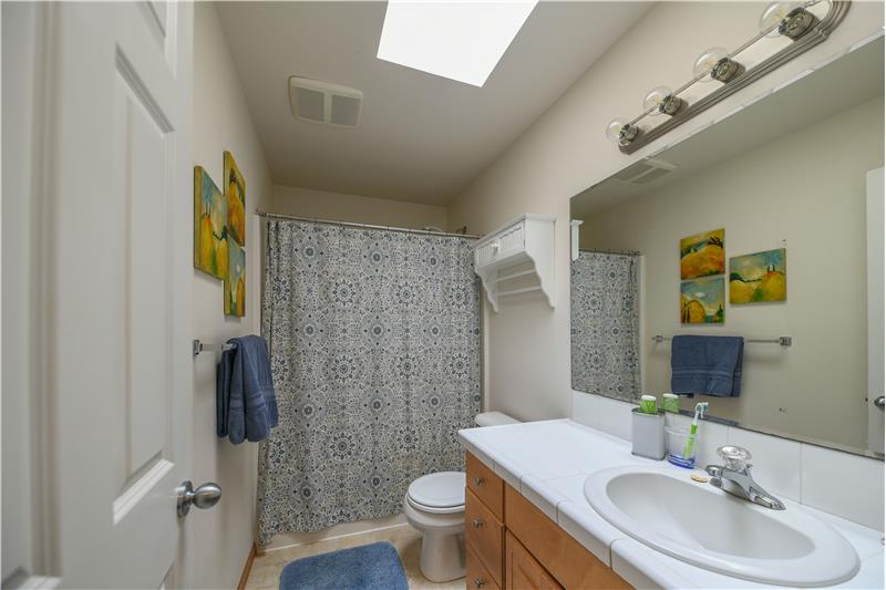 Second floor bathroom with skylight.