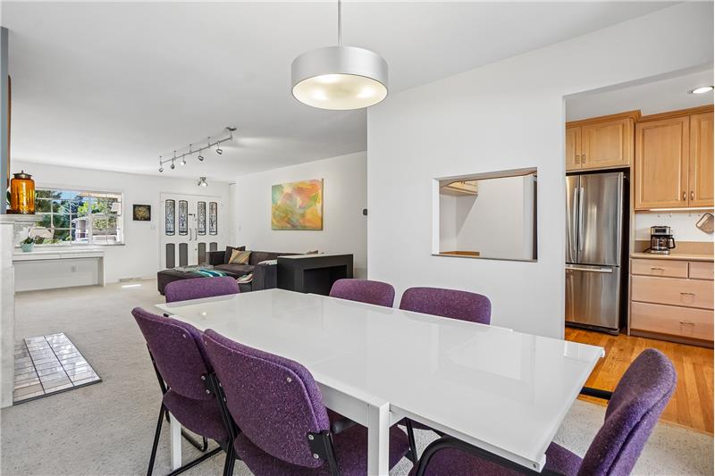Dining room with living room at left, kitchen at right