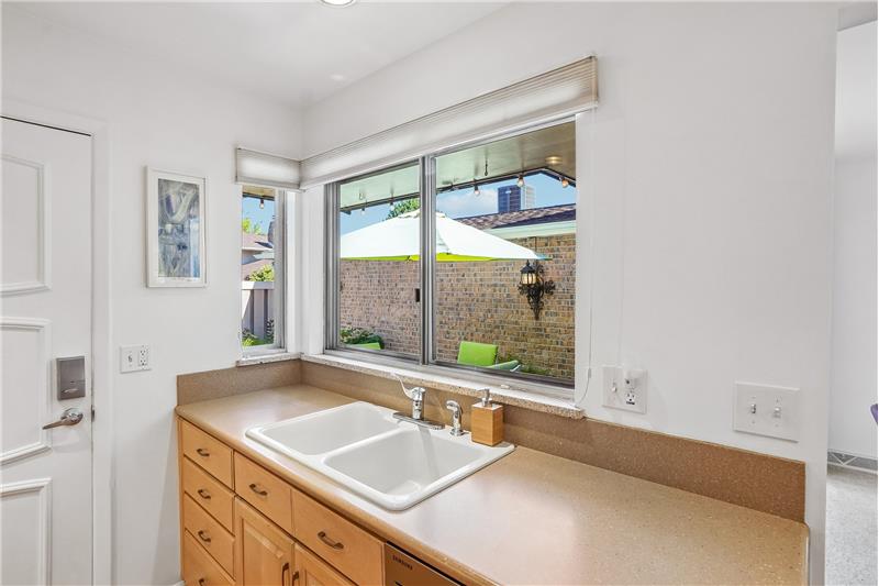 Kitchen window overlooks patio