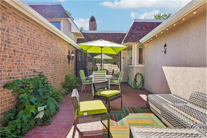 Private patio with string of lights for evening enjoyment