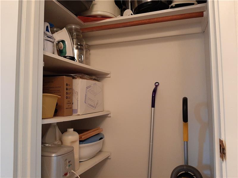 Opposite the Pantry is an additional Expanded Storage/Coat Closet, a nice feature in a 2/2.