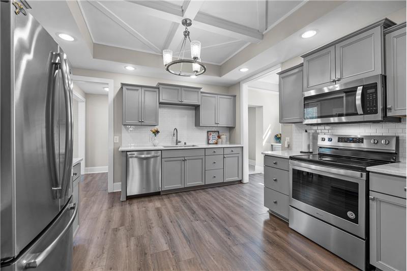 Kitchen with grey, shaker-style cabinets