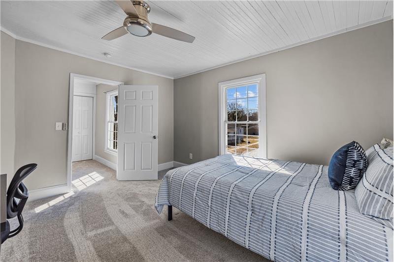 Lots of natural light, ceiling fan with light, wall-to-wall carpet