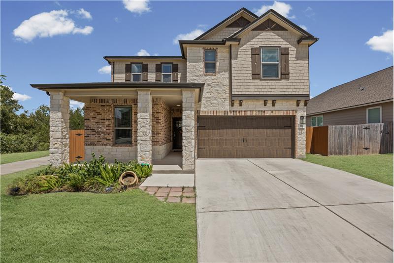 Beautiful home with manicured lawn.