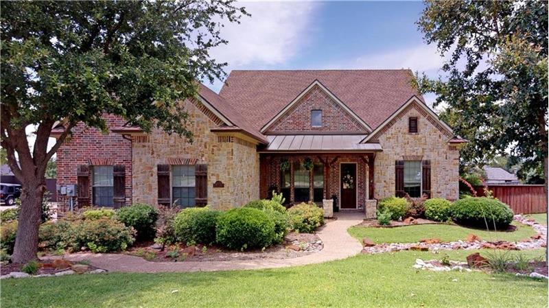 Gorgeous curb appeal on this greenbelt lot