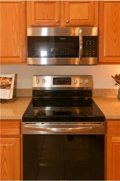 2017 Frigidaire Gallery Microwave and glass cooktop electric range (like new).