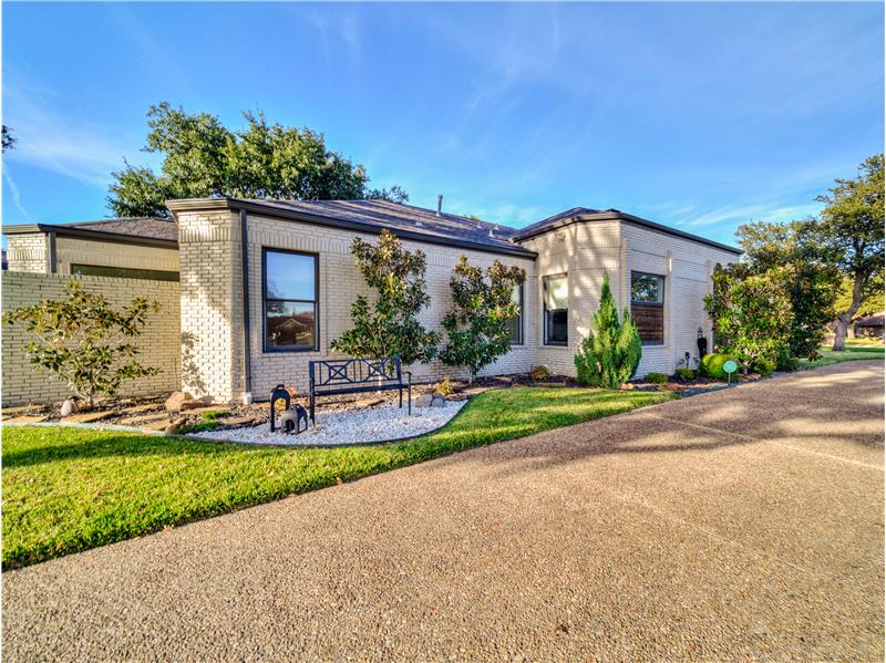 Curb Appeal Galore! Circular Driveway and pristine landscaping!