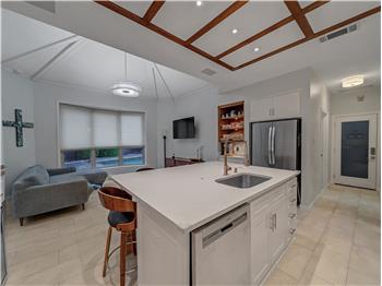 Kitchen with decorative wood trim ceiling, coffee station and beautiful brand new marble flooring!