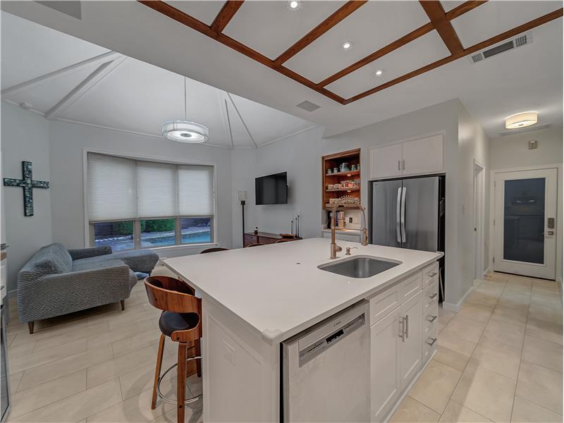 Kitchen with decorative wood trim ceiling, coffee station and beautiful brand new marble flooring!