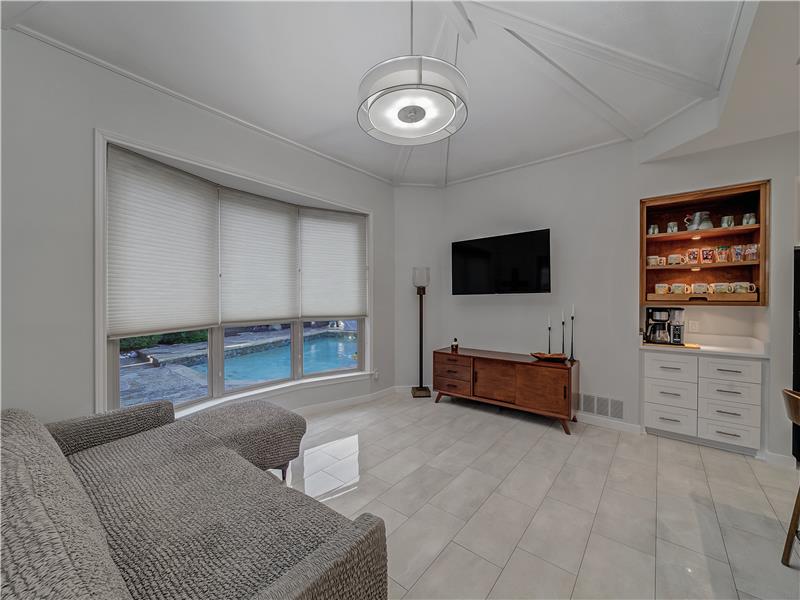 Kitchen overlooking the outdoor pool with 3 large PELLA oversized windows!