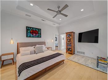 Bedroom featuring light wood flooring and ceiling fan