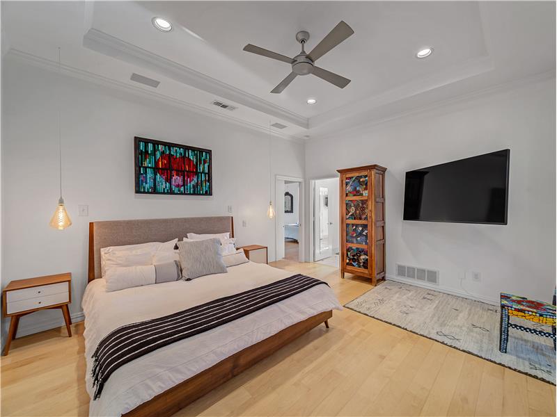 Bedroom featuring light wood flooring and ceiling fan