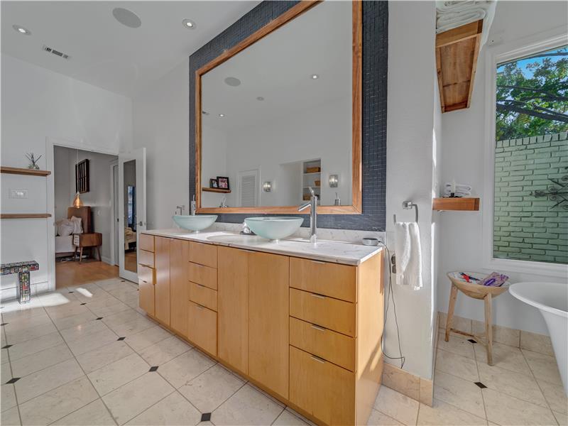 Primary bath with his and her walk in closets, water closet and wiring for a flat screen TV!