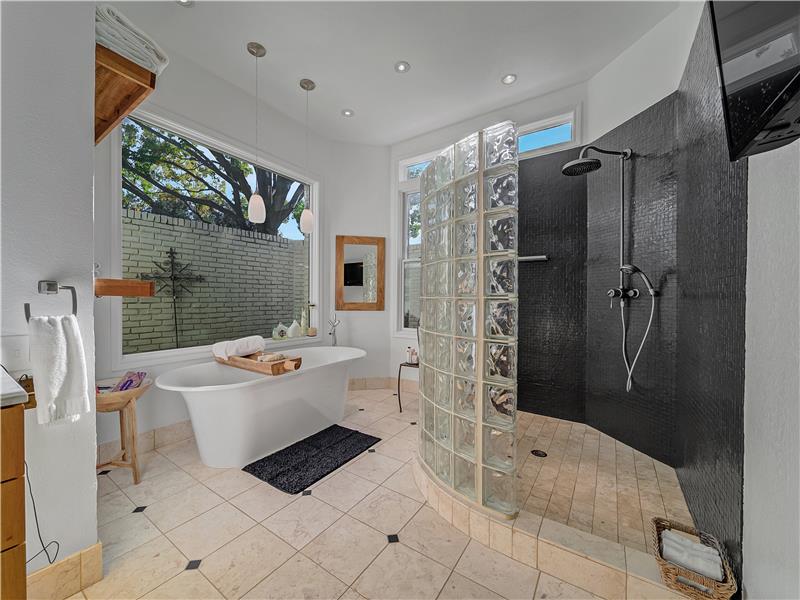 Spa like primary bathroom with huge walk in shower and free-standing tub!