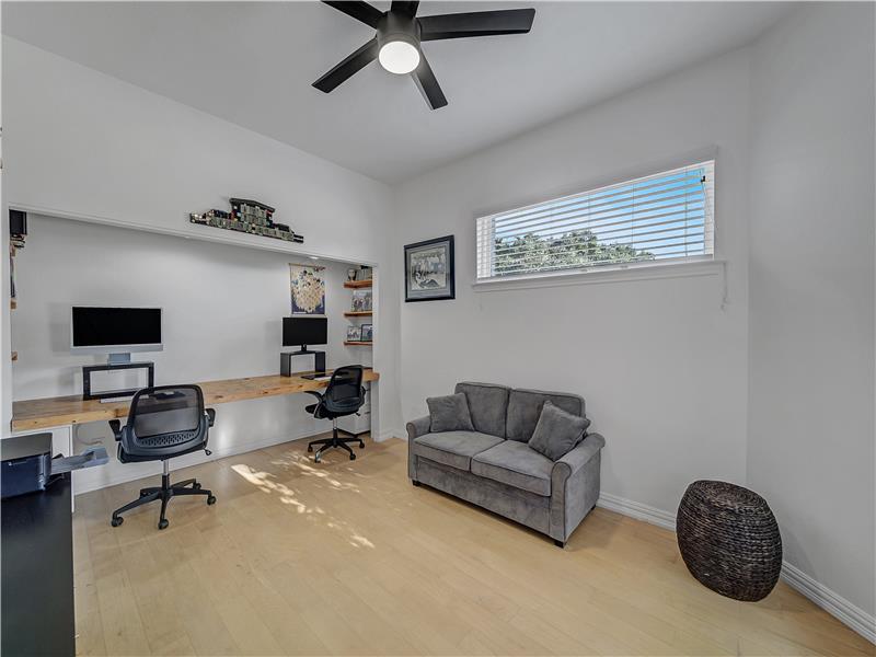 3rd bedroom or could be an Office space featuring ceiling fan and light Maple floors