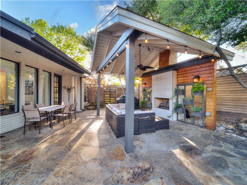 View of patio / terrace featuring a grill, an outdoor living space with a fireplace, and ceiling fan