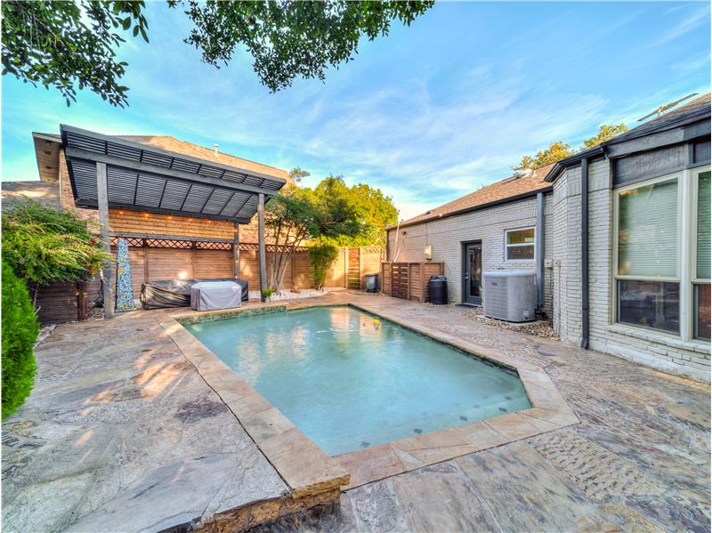 View of swimming pool with central AC and a patio area