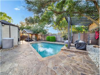 View of pool with area for grilling, cooling unit, a gazebo, and a pergola