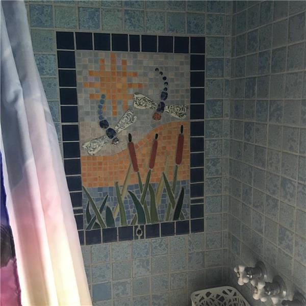 Mosaic inlaid tile in Shower