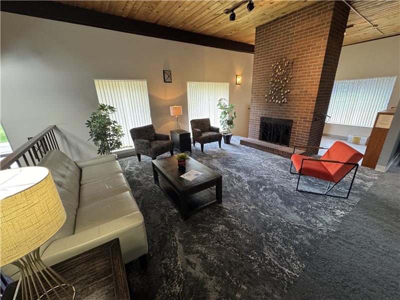 Living room with fireplace in clubhouse