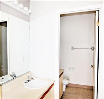 Full bathroom in primary bedroom suite