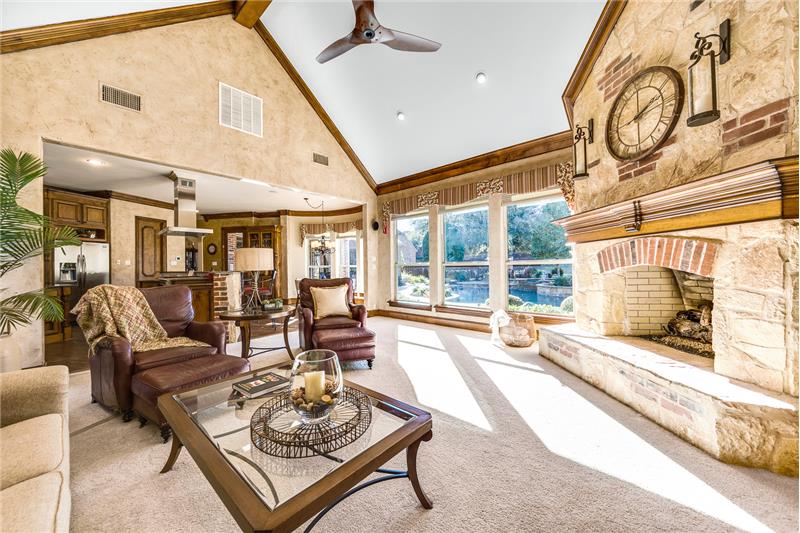 Family room with stunning stone and brick fireplace