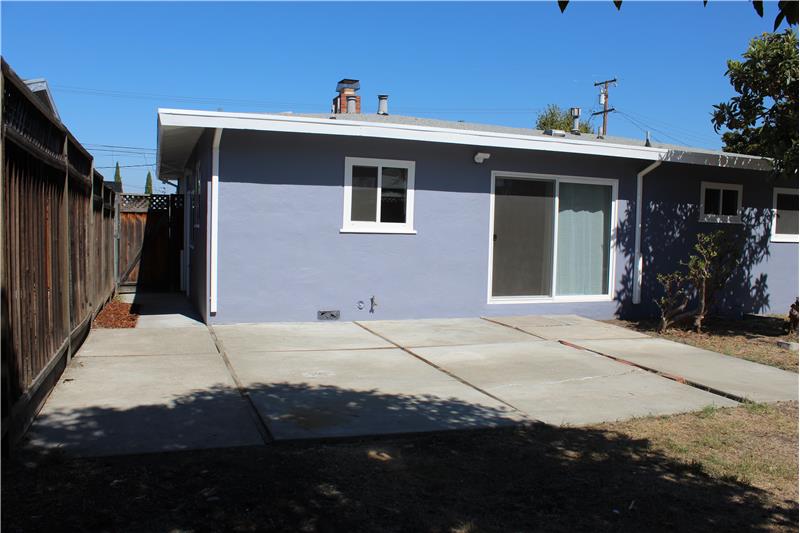 Patio and Side Yard with Access to Garage