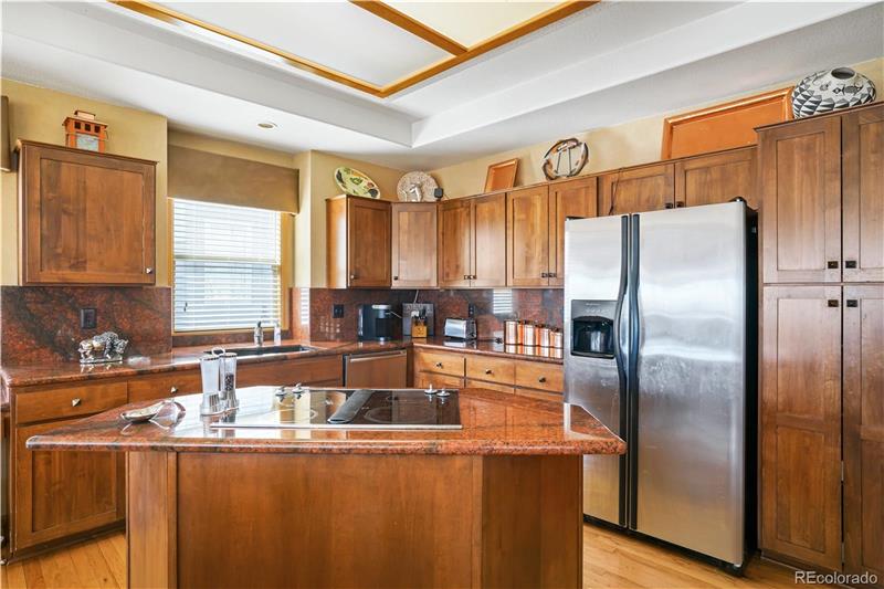 Kitchen with island. Note gorgeous granite countertops