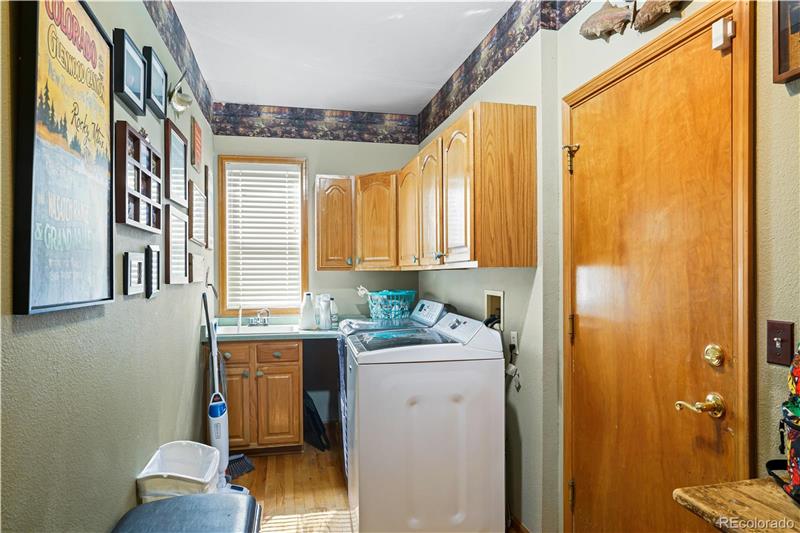 Laundry room doubles as mud room from garage (right)