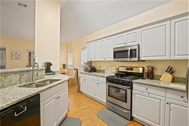 Stainless-steel appliances include refrigerator
