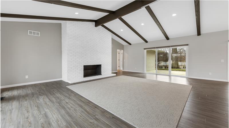 Vaulted ceiling, wood burning FP, replaced windows and doors.