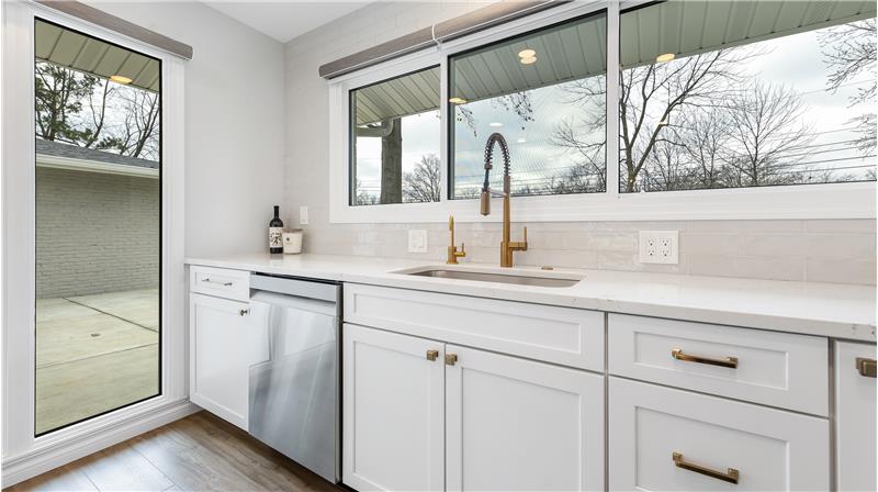 Lots of light and electric plugs in this kitchen.