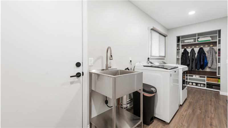 Laundry/mud room is 17x7. Stainless laundry sink, built in storage for coats and shoes. Door on the left side goes to the side p