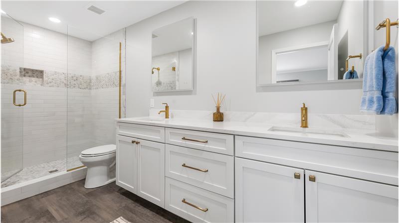 Outstanding bath with double sinks, touch light mirrors, oversized walk-in tile shower and fixtures.