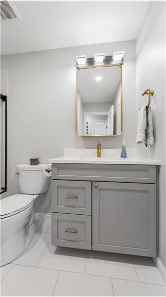 Hall Bathroom w/tile floor and is beauitful and updated.