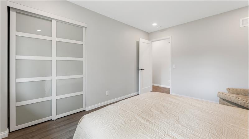 Bedroom #3 with a double closet with built-in's and recessed lighting