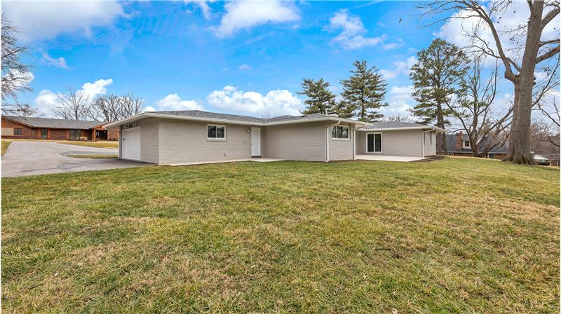 Oversized Garage, back door from the Laundry room to a 8x8 and patio and 4x16 walkway from the driveway.