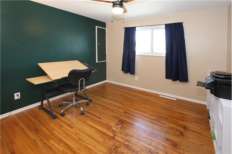 Bedroom 3 with hardwood flooring and ceiling fan