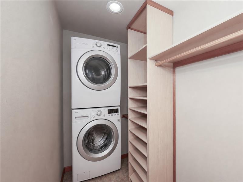 Washer & dryer hook ups in the primary walk-in closet. The stackable washer and dryer shown are virtual.