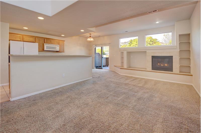 Living Room with built-in shelves, gas-log fireplace, and awesome views
